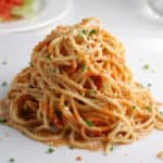 cold sesame noodles on a plate with peanut sauce