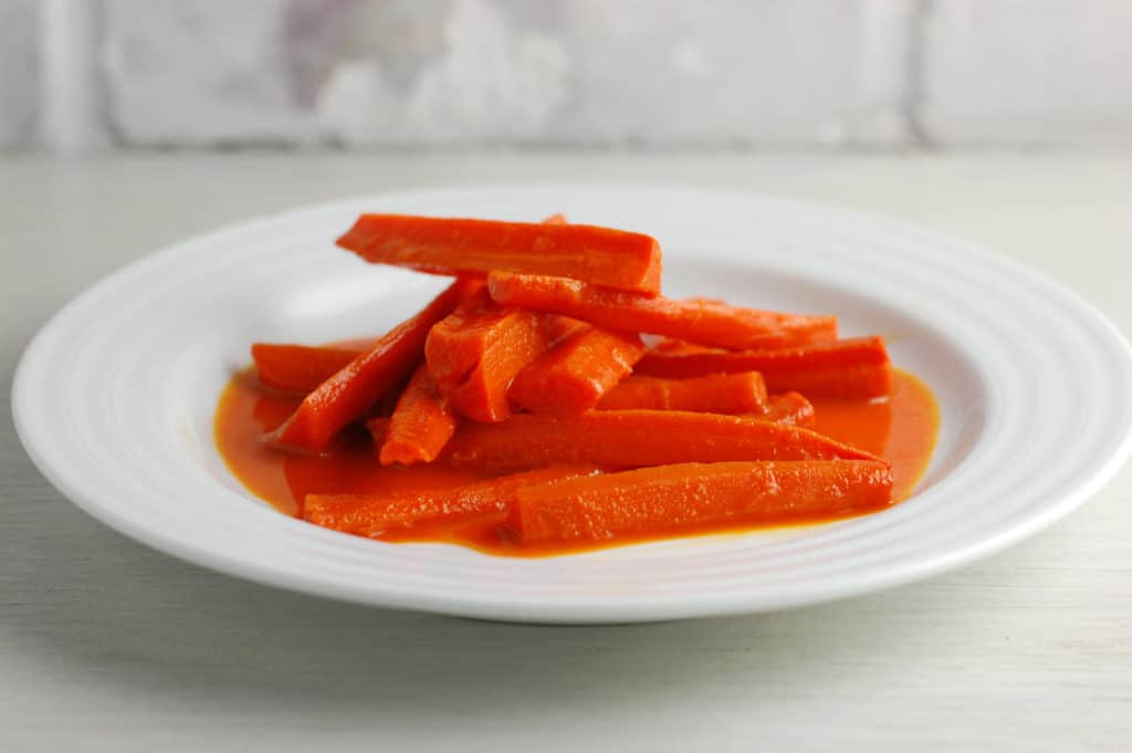 carrots braised in carrot juice on a plate