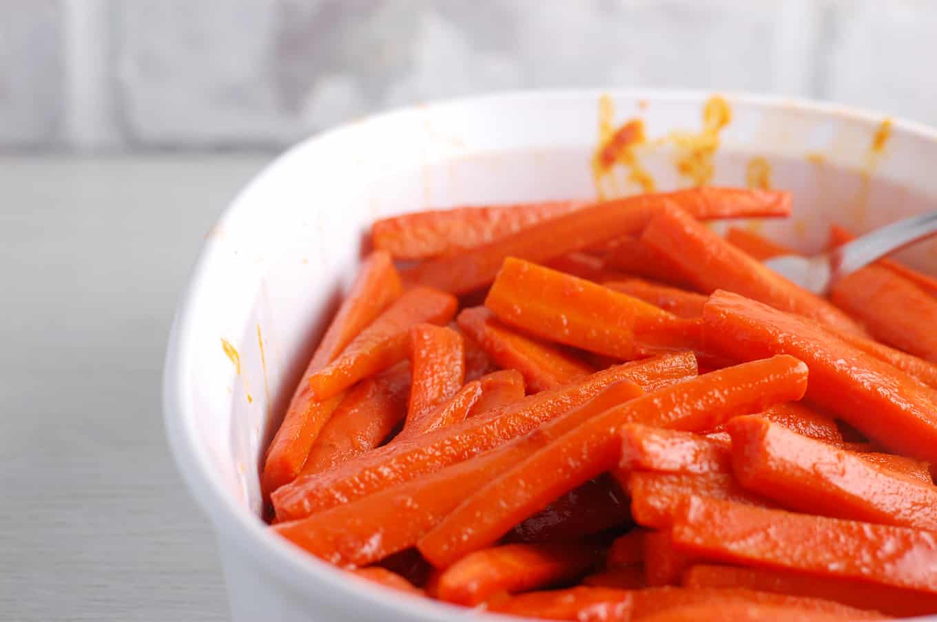 carrots braised in carrot juice in a casserole dish