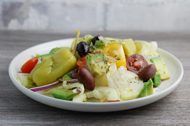 vegan avocado greek salad on a plate