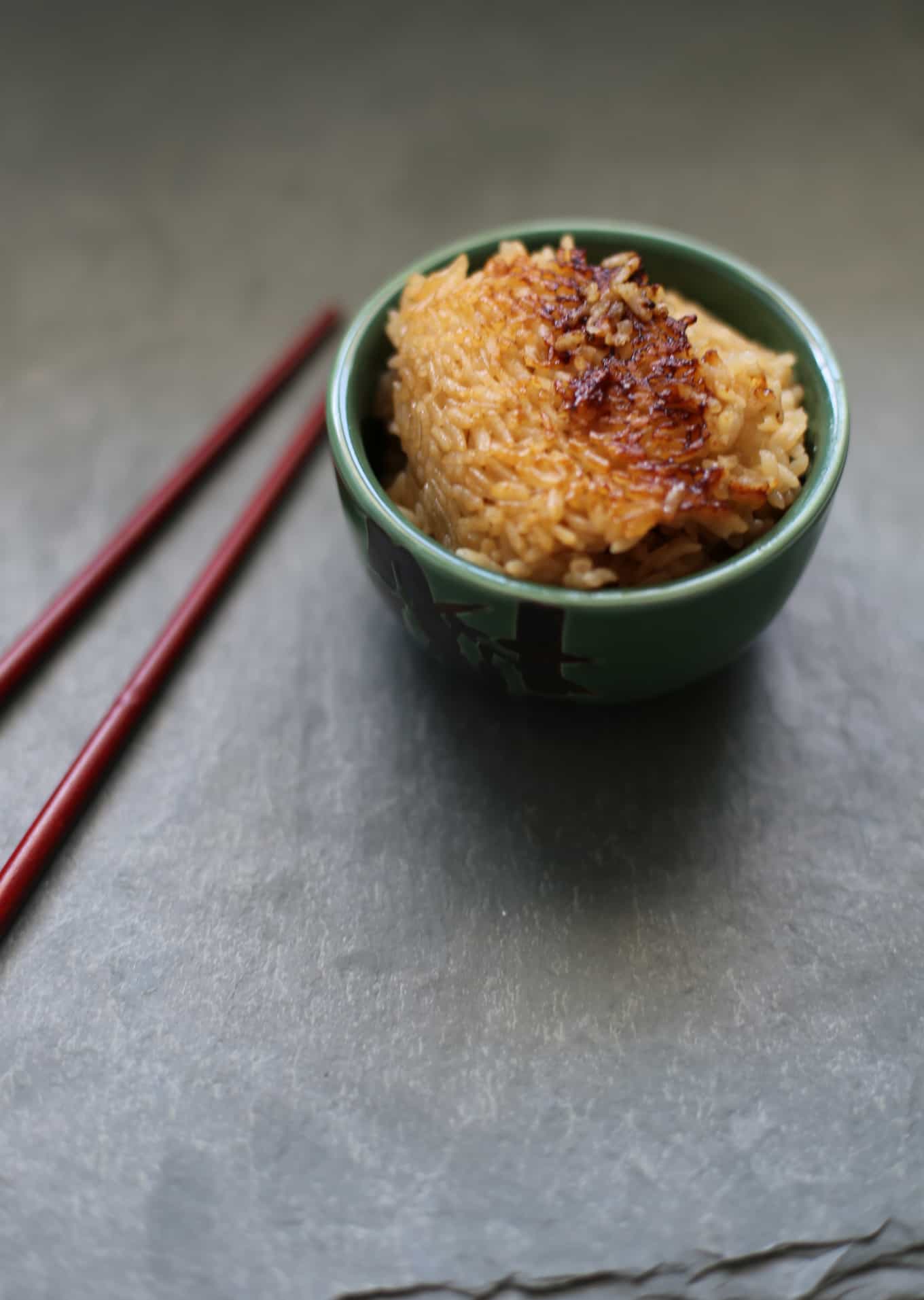 kombu dashi simmered rice in a bowl with chop sticks