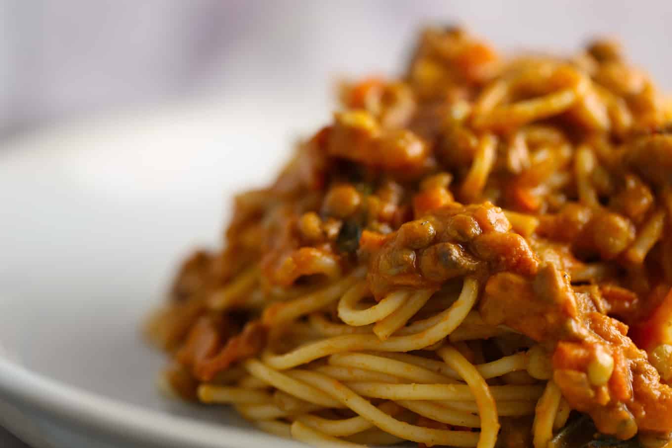 Plate with spaghetti and lentil bolognese sauce