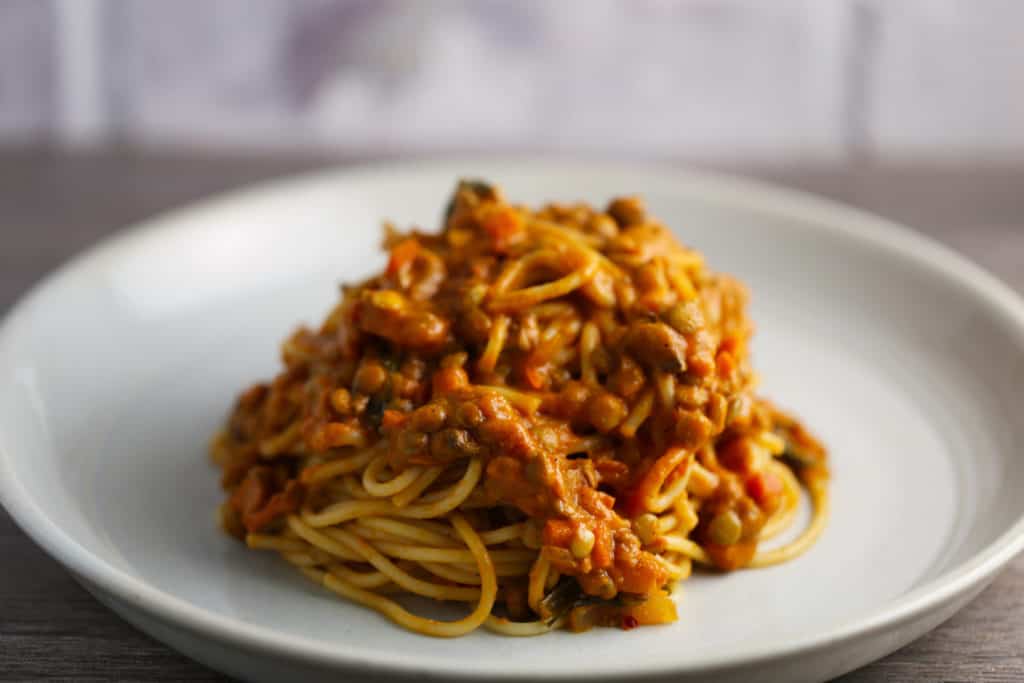 Plate with spaghetti and lentil bolognese sauce