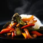 stir-fry sauce on veggies and rice