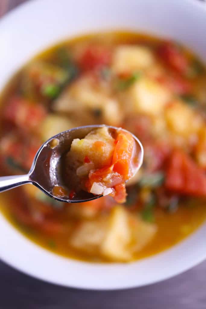 Tomato bread soup on a spoon