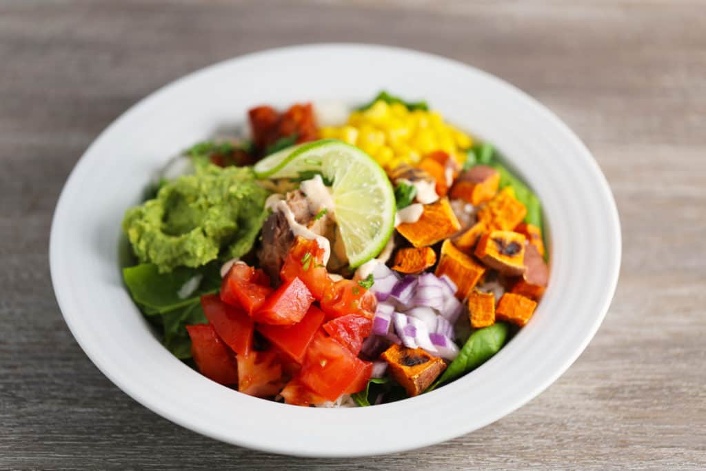 Refried Beans and Rice Bowl with Veggies and Smoky Cajun Sauce One