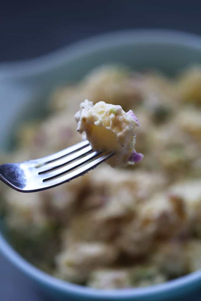 Vegan potato salad on a fork